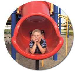 kid on slide in Mead, NE