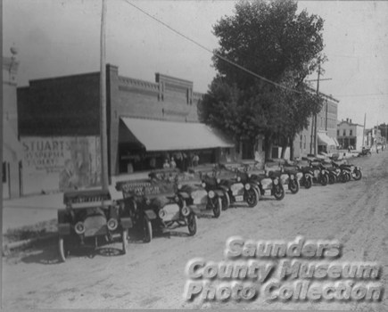 Old Autos lined up on the street